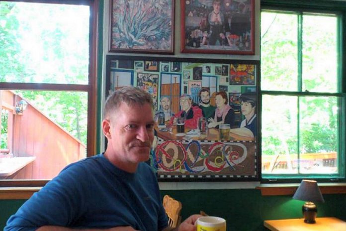 Local artist Bill Batten in front of one of his paintings at The Only in Peterborough. A well-known former bartender at the downtown eatery, Batten shares his memories of working there, along with those of long-time server Andrea Barrett (Photo: Sam Tweedle / kawarthaNOW)