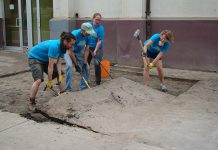 In Peterborough's first Depave Paradise project in June 2014, volunteers remove asphalt in front of the Brock Mission to prepare to transform the space into a garden