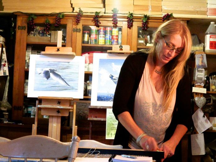 Artist Victoria Wallace at work in her studio where realism and her fascination with surrealism and the circus often collide. Wallace is one of the artists you can see in the Kawartha Autumn Studio Tour during the first weekend of fall.