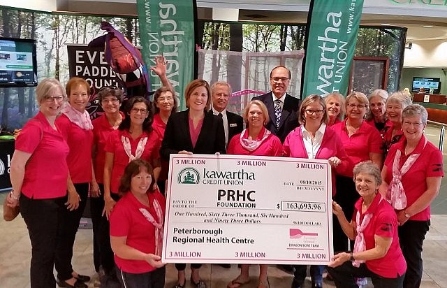 Members of the Peterborough Dragon Boat Festival committee and the Survivors Abreast team, accompanied by Kawartha Credit Union CEO Rob Wellstood and Peterborough Mayor Daryl Bennett, present a $163,693.96 cheque to Lesley Heighway, President and CEO of the PRHC Foundation. The proceeds will be used to purchase a new state-of-the-art digital mammography machine for PRHC's Breast Assessment Centre. (Photo courtesy of Rebecca Huels, Peterborough Regional Health Centre Foundation).