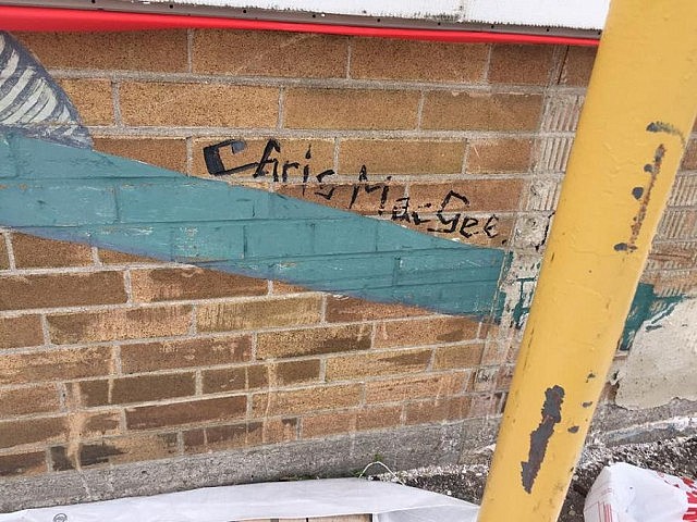 Chris MacGee's signature on the mural