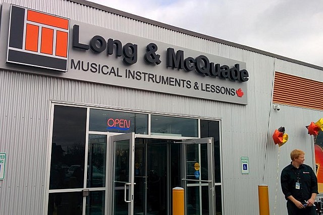 The entrance to Long & McQuade is located on the south side of the building, facing Townsend Street