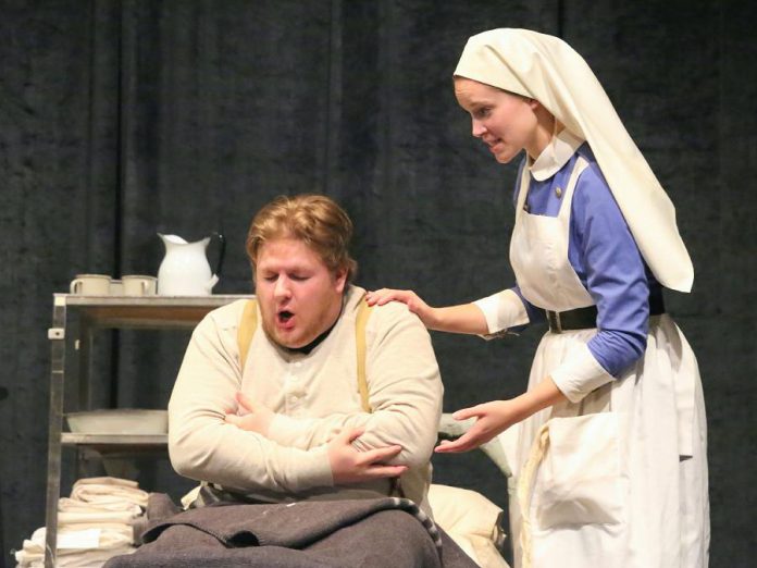 A scene from the Peterborough Theatre Guild production of "Vimy" with Josh Butcher as "shell shocked" soldier Will and Emily McFarland as Nurse Clare (photo: Ken Hurford)