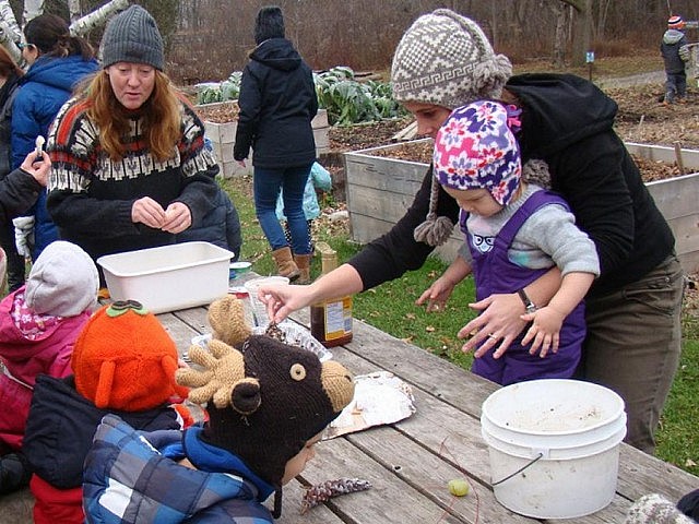 GreenUP’s Marcy Adzich explains how to roll pinecones in shortening and mixed bird seed to create homemade bird feeders