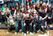 The cast of "American Idiot" with Andrew Little (Will), Ryan Hancock (Johnny), and Taylor Beatty (Tunny) in the first row. The production, featuring the music and lyrics of Green Day, runs for six performance only at Peterborough's Market Hall from December 4 to 10. (Photo: Linda McIlwain / kawarthaNOW)