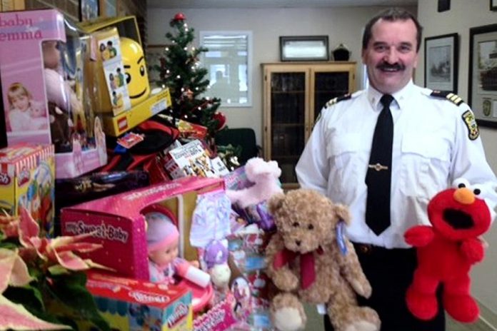 Chief training officer David Braun of Peterborough Fire Services with toys already donated. The firefighters are also giving $1,700 to The Toy Shop, which through the efforts of owner Jean Grant will translate into $3,000 worth of toys (Photo courtesy of Peterborough Fire Services)