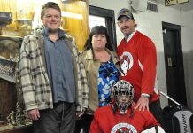 Cathie and Dave Tuck, founders of the Peterborough Huskies special needs hockey team, with their sons Jeffrey (left) and Criss (photo courtesy of the Peterborough Huskies)