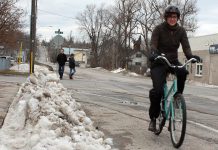 If you're used to dressing up warmly to shovel your driveway, you likely already have all the clothing you need to get out on your bike for Winter Bike to Work Day on February 12th. GreenUP's Brianna Salmon stays warm and dry while winter biking with good mitts, windproof pants, and water-proof boots. (Photo: Karen Halley, GreenUP)