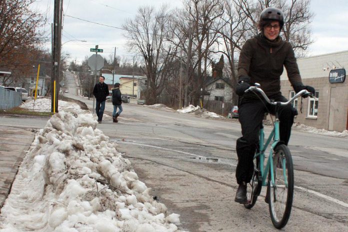 If you're used to dressing up warmly to shovel your driveway, you likely already have all the clothing you need to get out on your bike for Winter Bike to Work Day on February 12th. GreenUP's Brianna Salmon stays warm and dry while winter biking with good mitts, windproof pants, and water-proof boots. (Photo: Karen Halley, GreenUP)