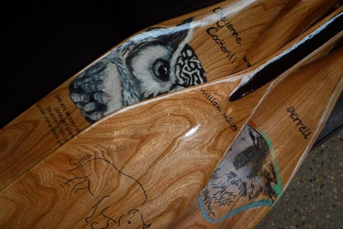 A detailed look at some of the paddles hand-crafted by Manitoba aboriginal students and displayed at the Canadian Canoe Museum's first Silver Canoe Dinner in Winnipeg (photo: Canadian Canoe Museum)