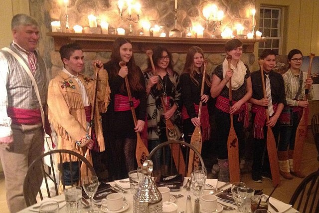 Instructor Mark Blieske with seven of the nine students from Lockport Junior High School displaying their paddles at the Silver Canoe Dinner (photo: Canadian Canoe Museum)