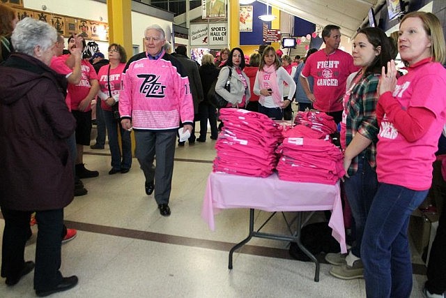 T-shirt and scarf sales before and during the game raised $20,200