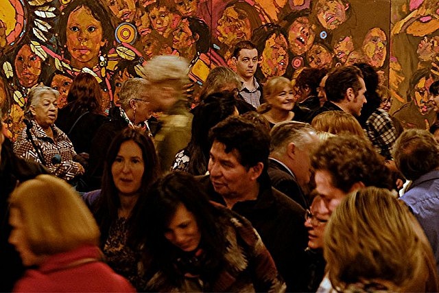 The crowd at the opening of the Art Gallery of Peterborough's current exhibitions, with Arthur Shilling's "The Beauty of My People" in the background (photo: Selrahc Yrogerg)