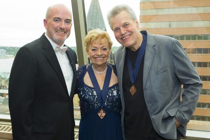 Dianne Leigh receiving her 2015 Medal of Honour from Canadian Country Music Hall President Don Green and 2014 Hall of Fame Inductee Wendell Ferguson (photo: Grant Martin Photography / CCMA)