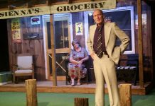 John Carter as fishing derby organizer Kirk Douglas and Deb Crossen as grocery store owner Sienna in The Hall's Bridge Players' production of Norm Foster's "The Great Kooshog Lake Hollis McCauley Fishing Derby" (photo: Keith Smith / The Hall's Bridge Players)