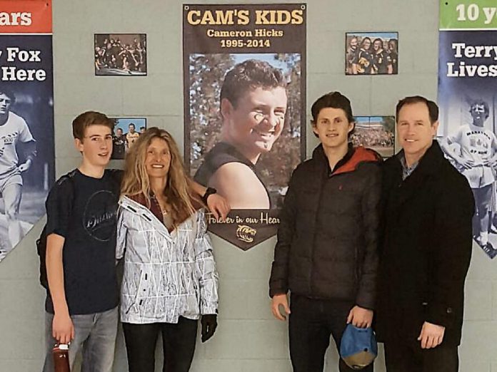 The Hicks family: Mitchell, Linda, Cameron (on poster), Andrew, and Gord. The family founded Cam's Kids in honour of Cam who, after overcoming anxiety issues as a teenager, was tragically killed by a motor vehicle at the age of 19 early in his first year at the University of Ottawa (photo courtesy of Cam's Kids)