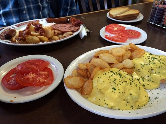 The Speak Easy's "world famous" Eggs Benedict. "We automatically love any diner that offers a side of tomatoes," Eva says.  (Photo: Eva Fisher / kawarthaNOW)