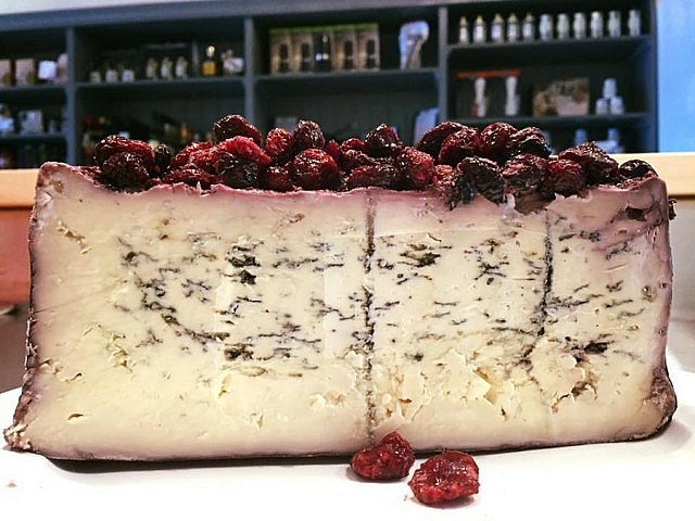 The aromatic and elegant Blu 61, a cheese dedicated to the year the cheese maker married, is ripened with wine and cranberries (photo: Delectable Fine Foods)
