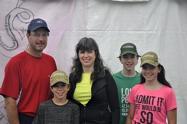 Nora Darling (middle) races because she knows how breast cancer affects families: her sister had breast cancer. "We always come to this event," she says. And now it's a family affair -- with her children volunteering in support of the cause.