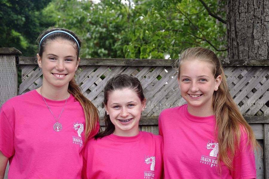 Thirteen-year-old Ellie Murdoch of Selwyn (middle) remembers her "grammy" having breast cancer, and the 2016 festival was her first time taking part in the event as a volunteer. "It feels nice to come here and fundraise for other people," she says. "Volunteering makes you feel good." Rileigh Darling (left) is here volunteering for the first time, along with her family.