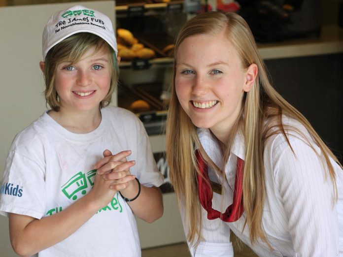 Kristian's son Eli with a McDonald's employee volunteering at McHappy Day in May to raise funds for the 9th Annual Nexicom James Fund Golf Classic, which takes place on Monday, June 6 at Kawartha Golf and Country Club in Peterborough (photo: Kristian Partington)