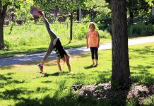 Children enjoy free time to play and explore at GreenUP Ecology Park, this spring; activities like climbing trees and playing tag outdoors builds brainpower. Research tells us that when children play in areas with a diverse array of plant life, they experience nature in ways that support creativity and problem solving. (Photo: Karen Halley)