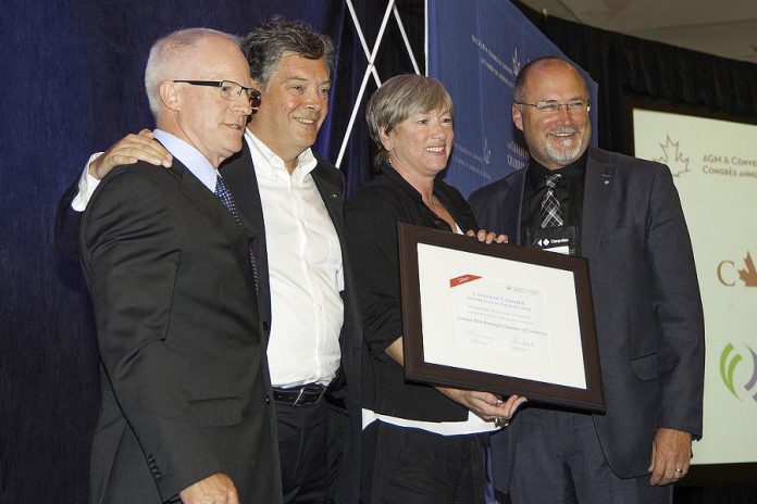 Karen August and Stu Harrison of the Peterborough Chamber of Commerce (right) accept the Chamber's Silver award from David Sword of the Canadian Association of Petroleum Producers and David Paterson of General Motors (photo courtesy of Peterborough Chamber of Commerce)