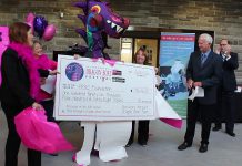 PRHC Foundation President and CEO Lesley Heighway (left) accepts a donation of $196,468.50 from members of Survivors Abreast and Peterborough's Dragon Boat Festival as PRHC President and CEO Dr. Peter McLaughlin and Peterborough mayor Daryl Bennett look on (photo: Impact Communications / PRHC Foundation)