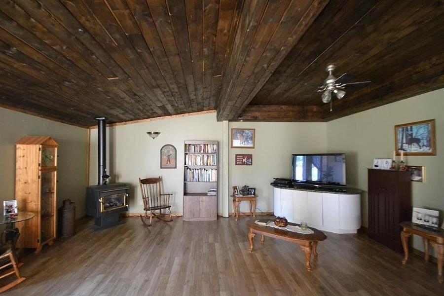 Barnboard ceilings and a gas stove in the in-law suite make for cozy nights indoors. (Photo: Dan Parker)