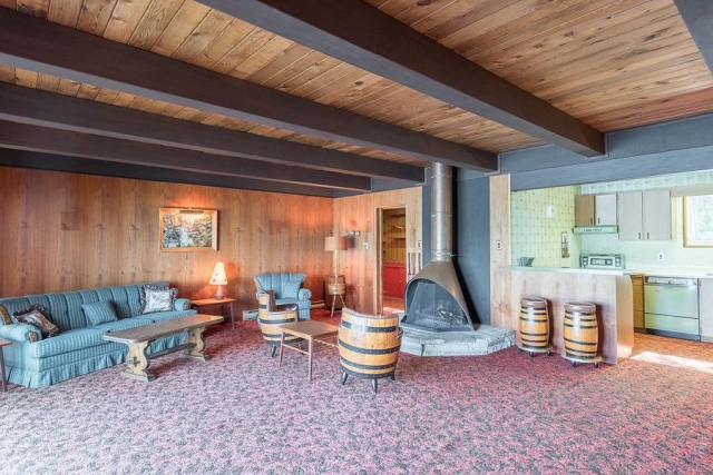 A copper acorn fireplace on the lower level is still in use. (Photo: Peterborough Fine Homes Photography)