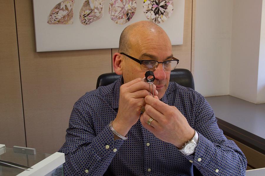 John examines a diamond in Antwerp. These diamonds are bought for clients in the Kawarthas. (Photo: Johnson's Jewellers)