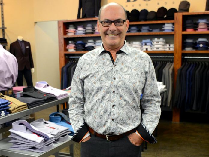 John Martin, owner of John Roberts Clothiers in downtown Peterborough, shows how to achieve an office-appropriate look with this Au Noir shirt. No tie is required, as the collar looks great unbuttoned. (Photo: Eva Fisher)