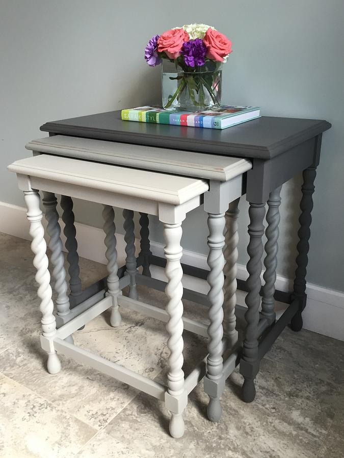 Nesting tables painted in tonal shades of grey creates a decor statement. (Photo: Style Your Nest)