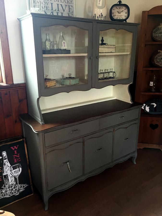 The painted knobs look sculptural on this beautifully distressed dining hutch. (Photo: Style Your Nest)