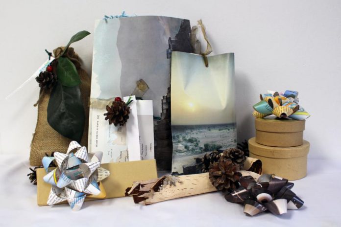 Switching to eco-friendly gift wrapping does not mean you have to forgo the excitement. Old books, magazines, and maps can be repurposed into decorative envelopes and bows while pinecones, birch bark, and small sprigs of evergreen can add decorative personal touches to your gifts. (Photo: GreenUP)