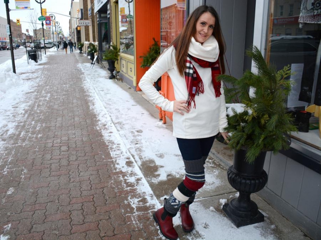 Brittany Thompson, manager of the Lindsay location, wears Lola jeans, a V. Fraas scarf, a Fig sweater, Blundstone boots, and recycled legwarmers by 3r Clothing Company. (Photo: Eva Fisher)