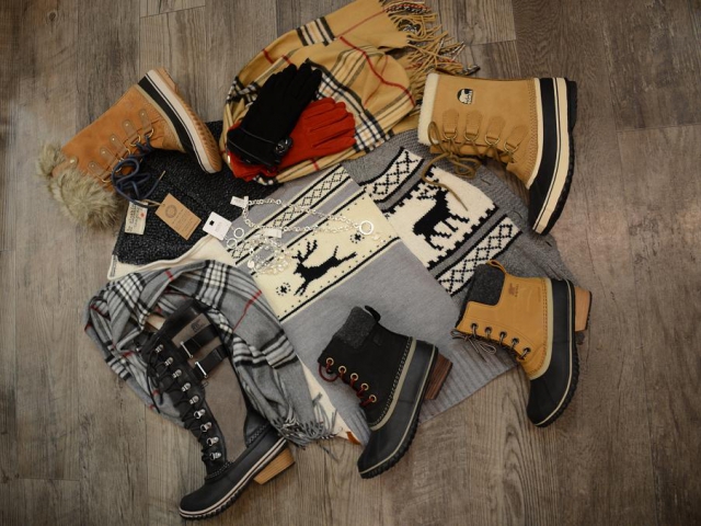 These are just some of the cozy Sorel boots available at Brittany n' Bros. Also featured is a poncho made from recycled sweaters by 3r Clothing Company, Nora jewelry and Au Clair gloves. (Photo: Eva Fisher)