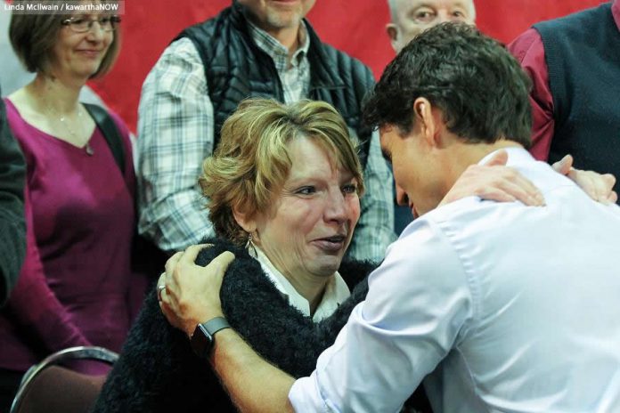 Prime Minister Justin Trudeau comforts an emotional Kathy Katula at the town hall in Peterborough. The single working mom from Buckhorn was upset about the high cost of hydro and the possibility of paying a carbon tax when she's already struggling to make ends meet. (Photo: Linda McIlwain / kawarthaNOW)