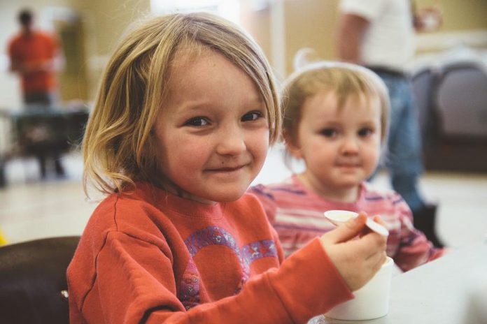 Two young soup fans enjoy the offerings at last year's Lindsay SoupFest. This year's event takes place on February 25 at the Victoria Park Armoury. (Photo: Youth Unlimited SoupFest Committee)