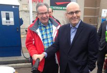 Peterborough MPP Jeaf Leal and Ontario Minister of Transportation Steven Del Duca demonstrate the electric vehicle charging station at Lansdowne Place Mall. The mall is one of seven locations in the City and County of Peterborough offering electric vehicle charging, which is free for the first year of operation. (Photo: Paul Rellinger / kawarthaNOW)