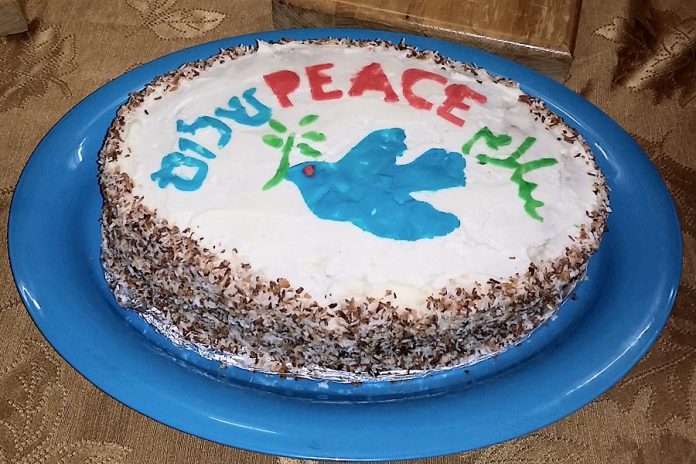 The Peace Cake (with "peace" written in Hebrew, English, and Arabic) served after the multi-faith service on February 8 at Peterborough's Beth Israel Synagogue (photo: Shegufa Shetranjiwalla-Merchant)