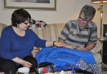 Colleen Carruthers, who is coordinating the 150 Canadian Women Quilt project for the Peterborough Women's Business Network, with fellow quilter Debbie Fisico. (Photo: Jeanne Pengelly / kawarthaNOW)