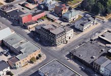 An aerial view of the Morrow Building at George and Brock streets in downtown Peterborough, with the two adjoining buildings housing the Black Horse Pub and the Pig's Ear Tavern. While the Morrow Building itself was designated as a heritage building in 1995, Peterborough City Council has decided not to approve heritage designation for the adjoining buildings, allowing them to be redeveloped by Parkview Homes. (Photo: Google)