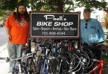 Patrick Poell with his dad Ed of Poell's Bike Shop, which recently moved to 366 George Street in downtown Peterborough