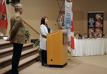 As Community Futures Peterborough member Gord James looks on, Peterborough-Kawartha MP Maryam Monsef speaks at a March 2nd showcase highlighting successes under the Eastern Ontario Development Program, a federal grant program to advance economic development in rural eastern Ontario. In the Peterborough area, Community Futures Peterborough administers the program that has benefited 557 organizations and businesses over the past 14 years. (Photo: Jeannine Taylor / kawarthaNOW)