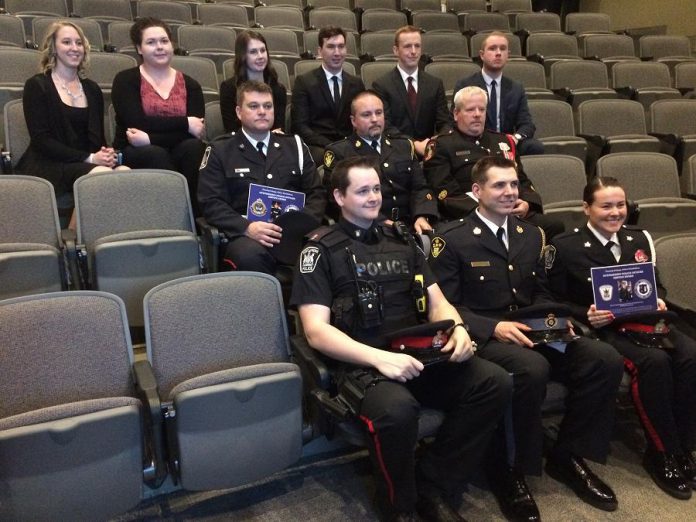 The police officers who received the Outstanding Police Officer Service Award with the students from Fleming College's Police Foundations program who presented the awards (photo courtesy of Fleming College)