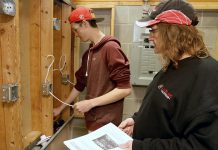 St. Stephen Catholic Secondary School student Zack Dingwall, 17, who is enrolled in the electrician course as part of the Ontario Youth Apprenticeship Program at Durham College, takes instruction from teacher Jeff Van Moosdyk at the Whitby Trade Centre.