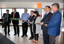 Cutting the ribbon at the newly renovated Innovation Cluster space at VentureNorth on April 19 (left to right): Fleming College president Dr. Tony Tilly, Peterborough Mayor Daryl Bennett, Peterborough M.P.P. Jeff Leal, Innovation Cluster Board Chair John Desbiens, Peterborough-Kawartha MP Maryam Monsef, Innovation Cluster President and CEO Michael Skinner, and Trent University Vice-President of Research and Innovation Dr. Neil Emery. (Photo: Eva Fisher / kawarthaNOW)