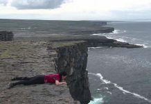 In this scene from the award-winning "Murphy's Law", which returns to Showplace for a screening on May 12, filmmaker Megan Murphy lies at the edge of a cliff on the Aran Islands in Ireland. It was the same spot where her father, taking the same journey of self-discovery in 1973, decided to spend the rest of his life with Megan's mother. (Photo: Megan Murphy)