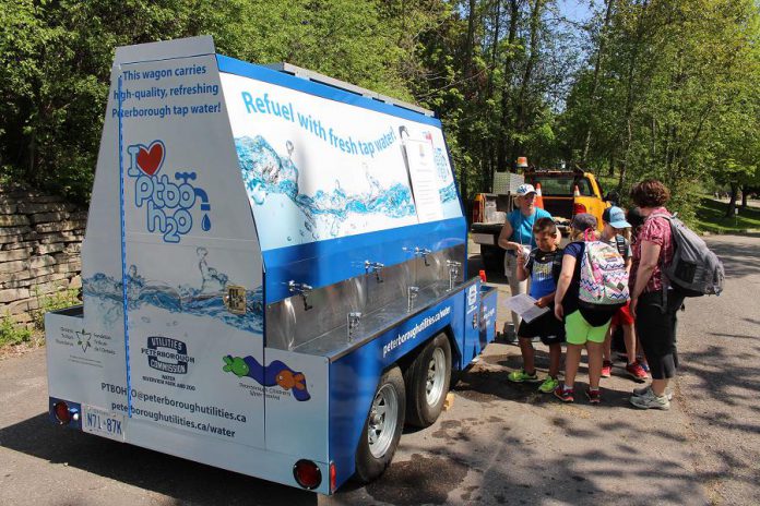 Children at the Peterborough Children's Water Festival learn about the benefits of drinking municipal tap water at the PTBO H20 mobile tap water station. This 'water buggy' provides a supply of fresh tap water to refill reusable bottles and can be used as a drinking fountain, too. Watch for the Peterborough Utilities' PTBO H20 at community events throughout the Peterborough area this summer, and fill up your reusable water bottle for free. (Photo: Karen Halley)